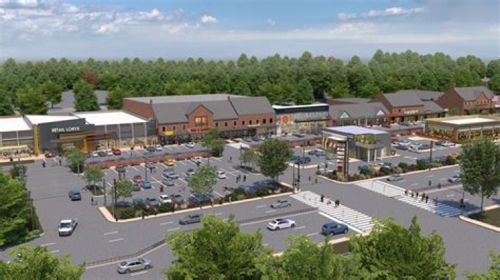 Who owns edmondson village shopping center?