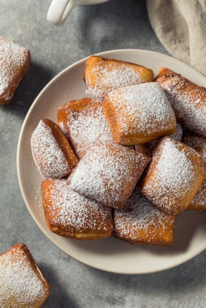 Why are beignets served in threes?