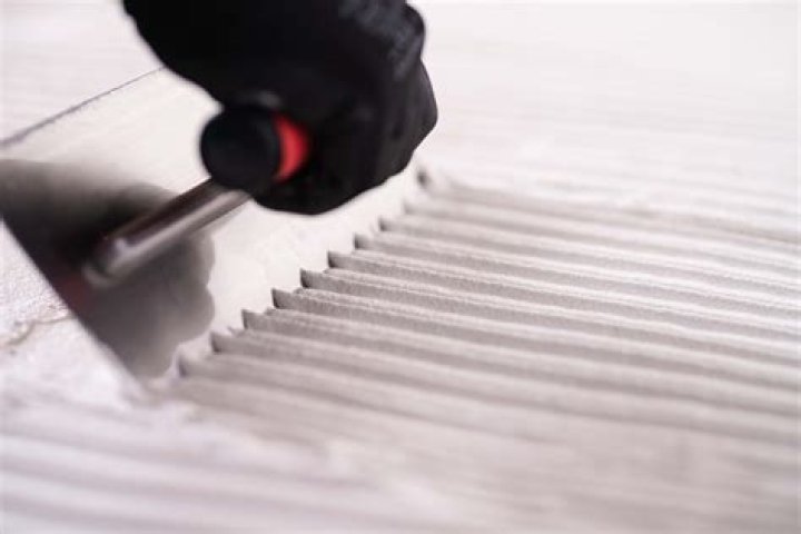 Why do tile trowels have notches?